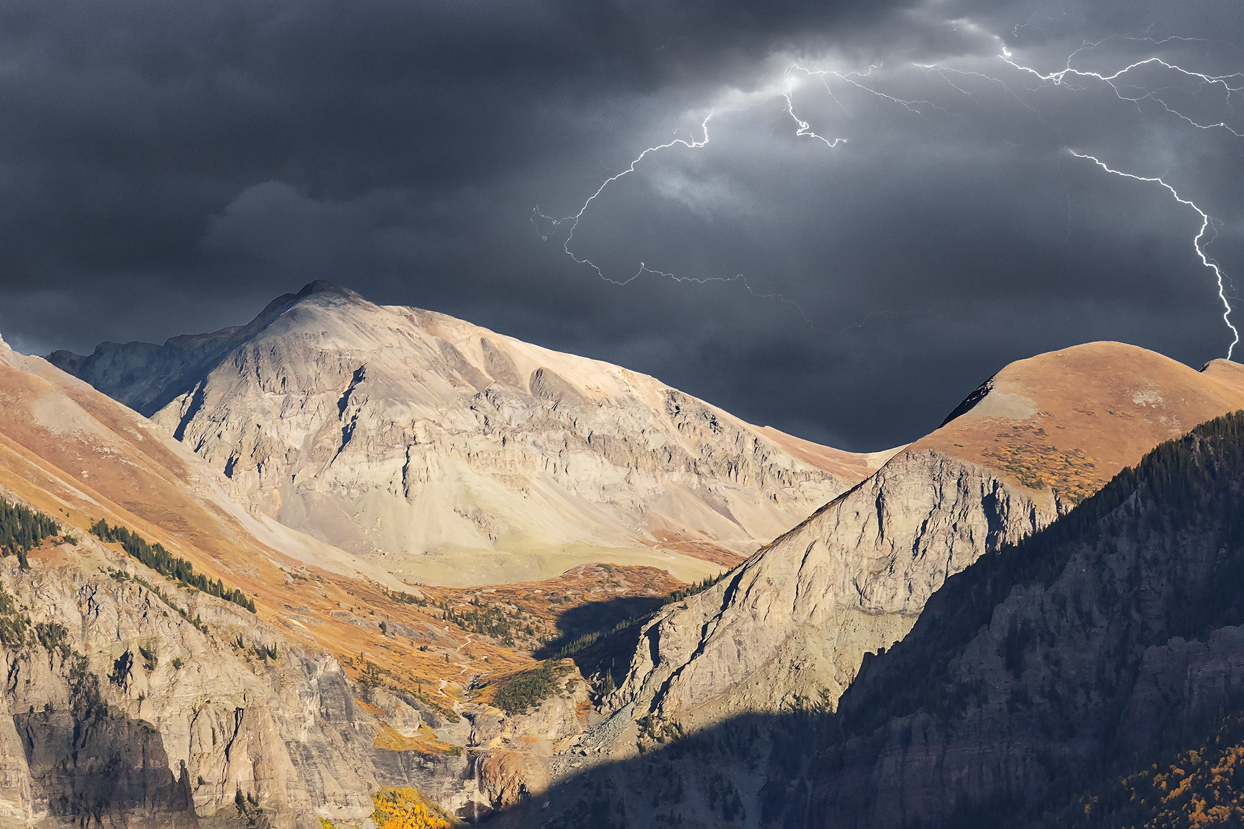 Lightening during a storm telluride near ajax peak mountain in fall