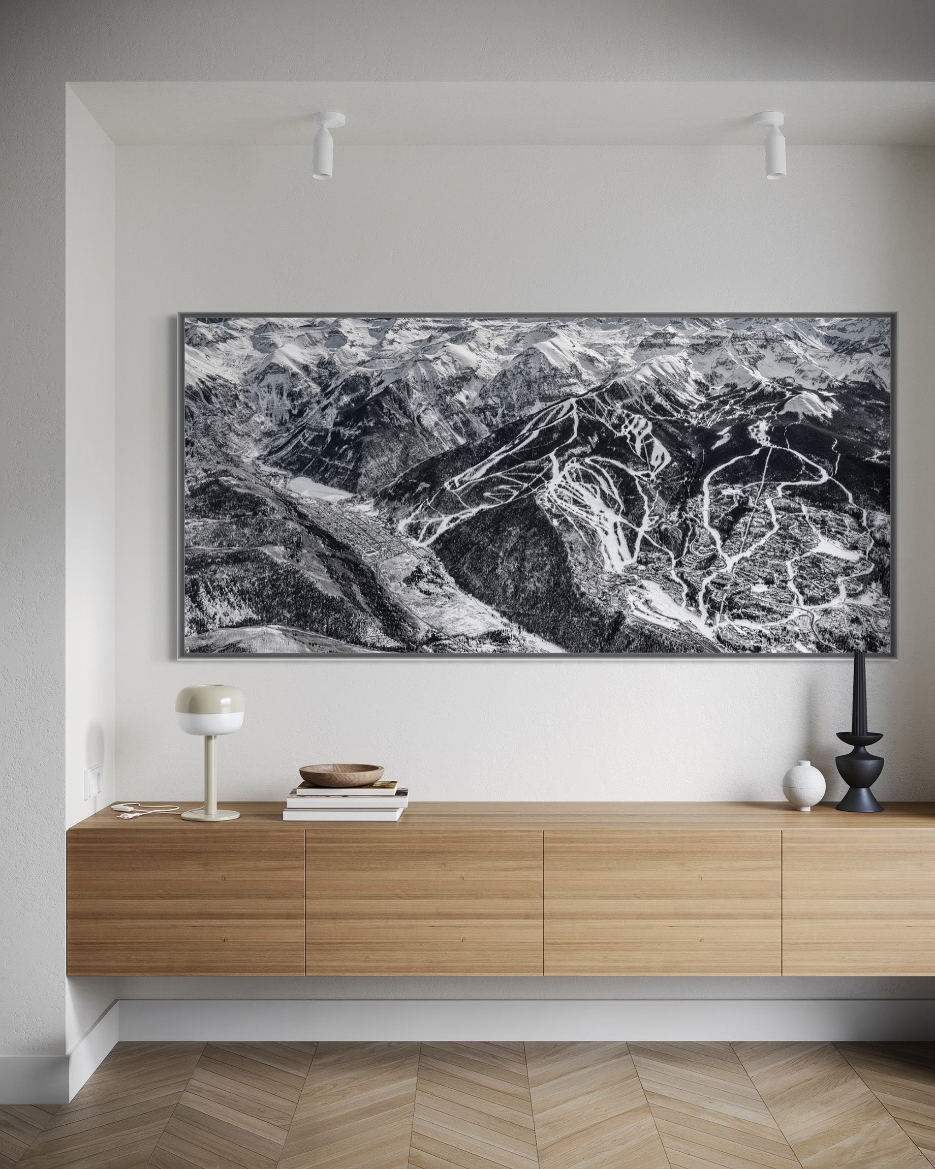 A picture of the telluride ski area map in a frame in entry way