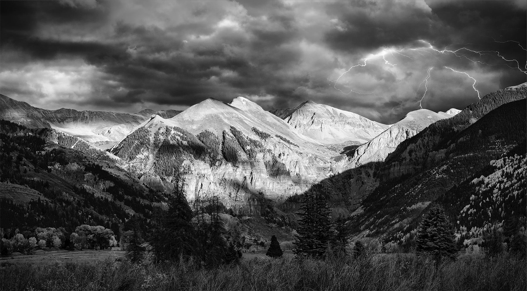 Black and white image of a lightening storm over Ajax mountain in Telluride Colorado