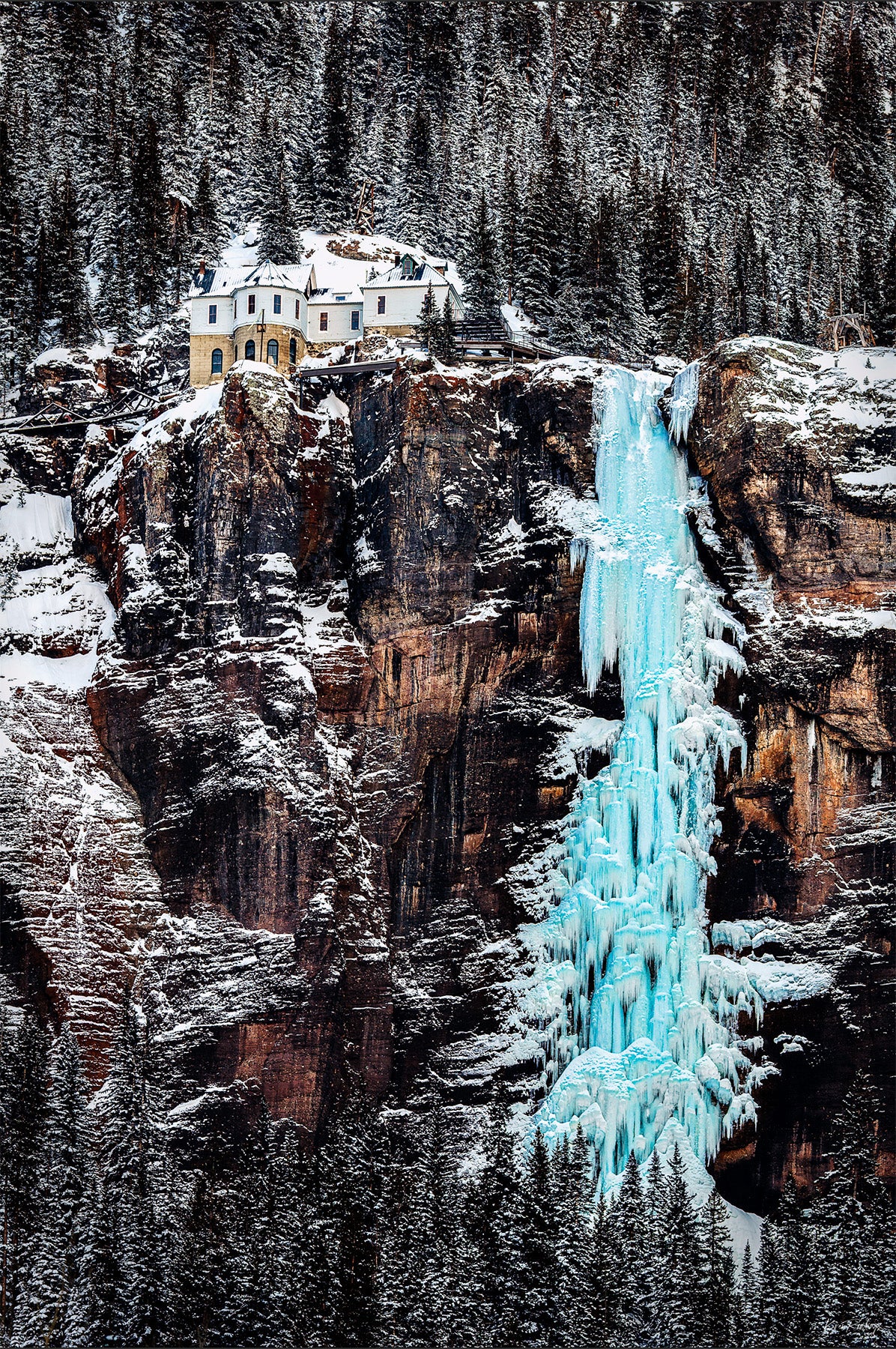 Professional photo of frozen bridal veil falls and power station in telluride colorado.