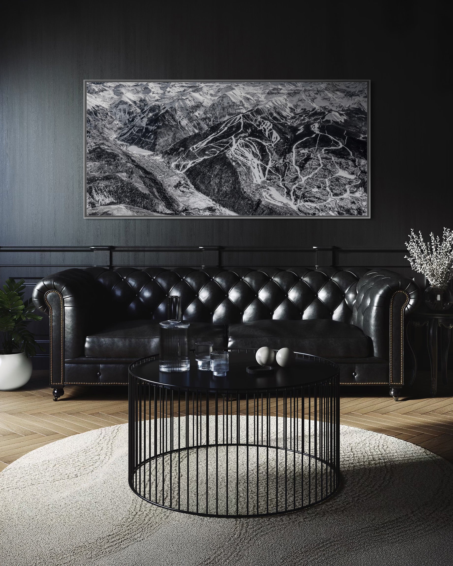 Living room with framed Telluride print of ski resort map