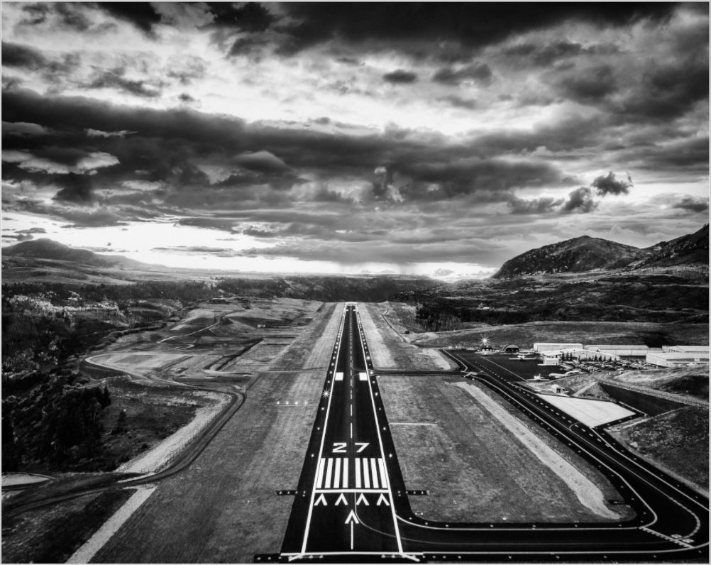 Landing approach runway 27 Telluride Airport at Sunset in fall. 