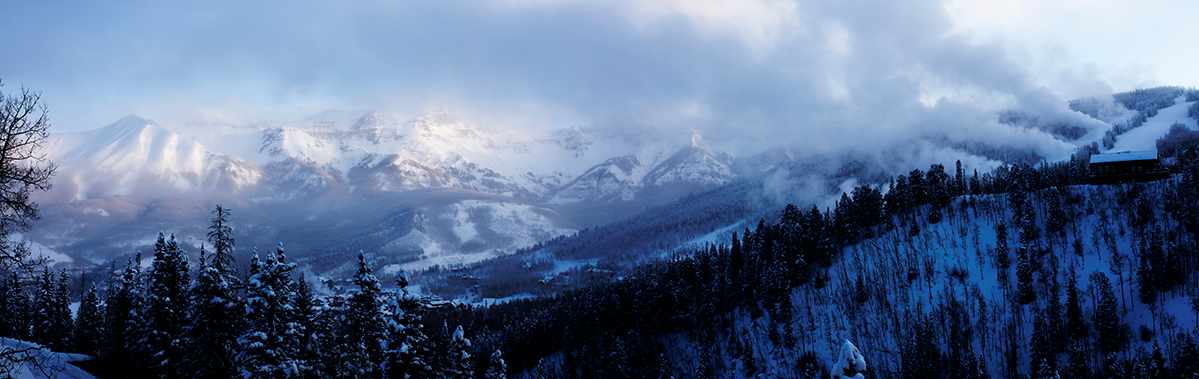 Panoramic photograph of Telluride Snow Making machines with Mountain Village in the distance.  