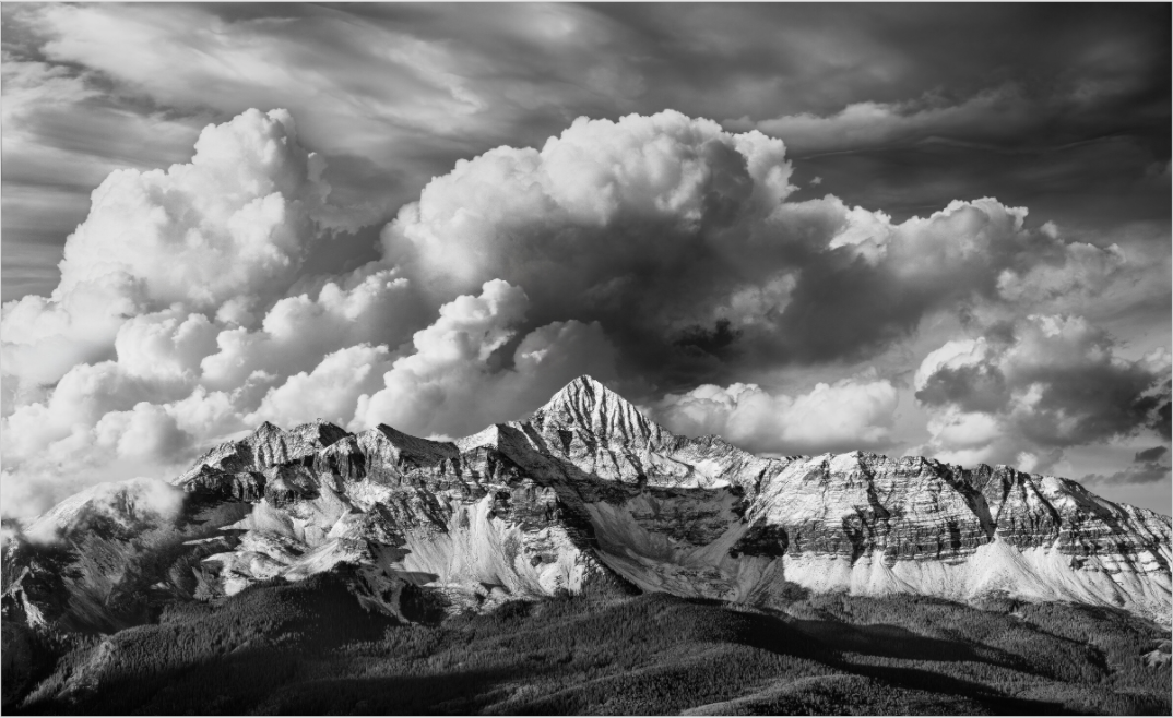 Image of Wilson Peak with storm cloud