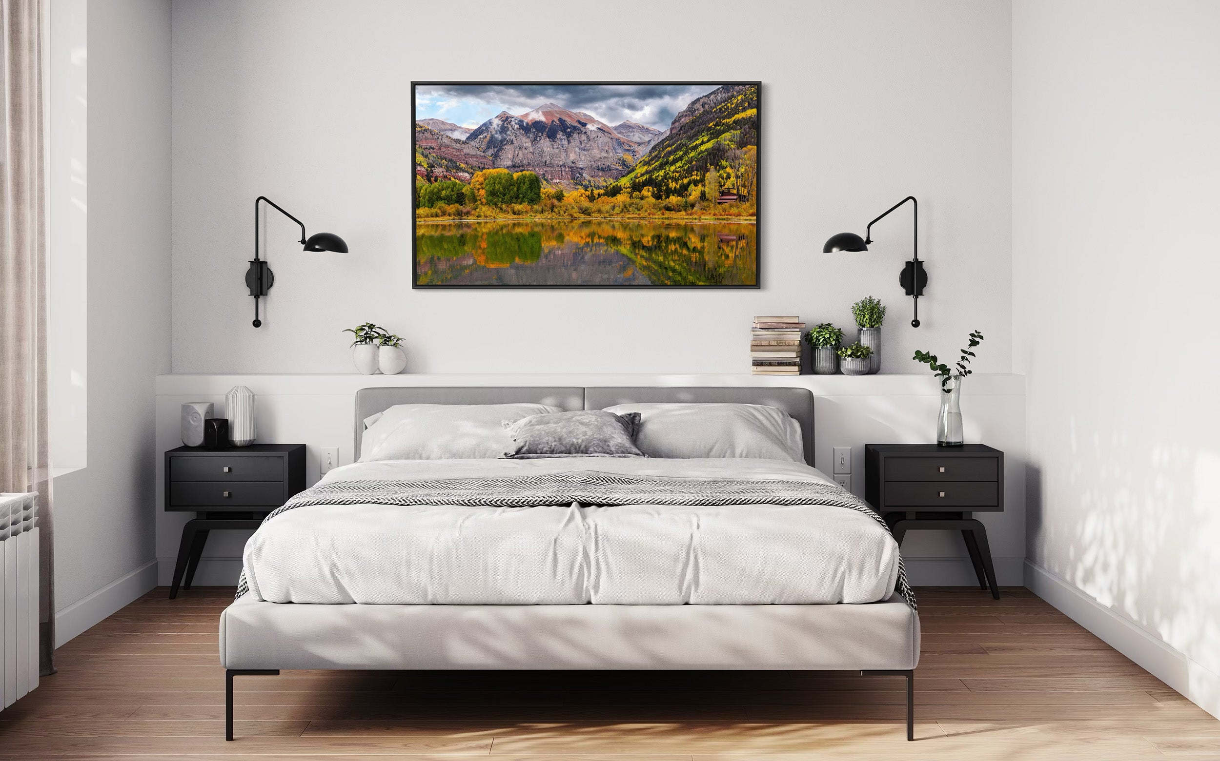 A bedroom with a picture of fall leaves in Telluride beaver pond in autumn