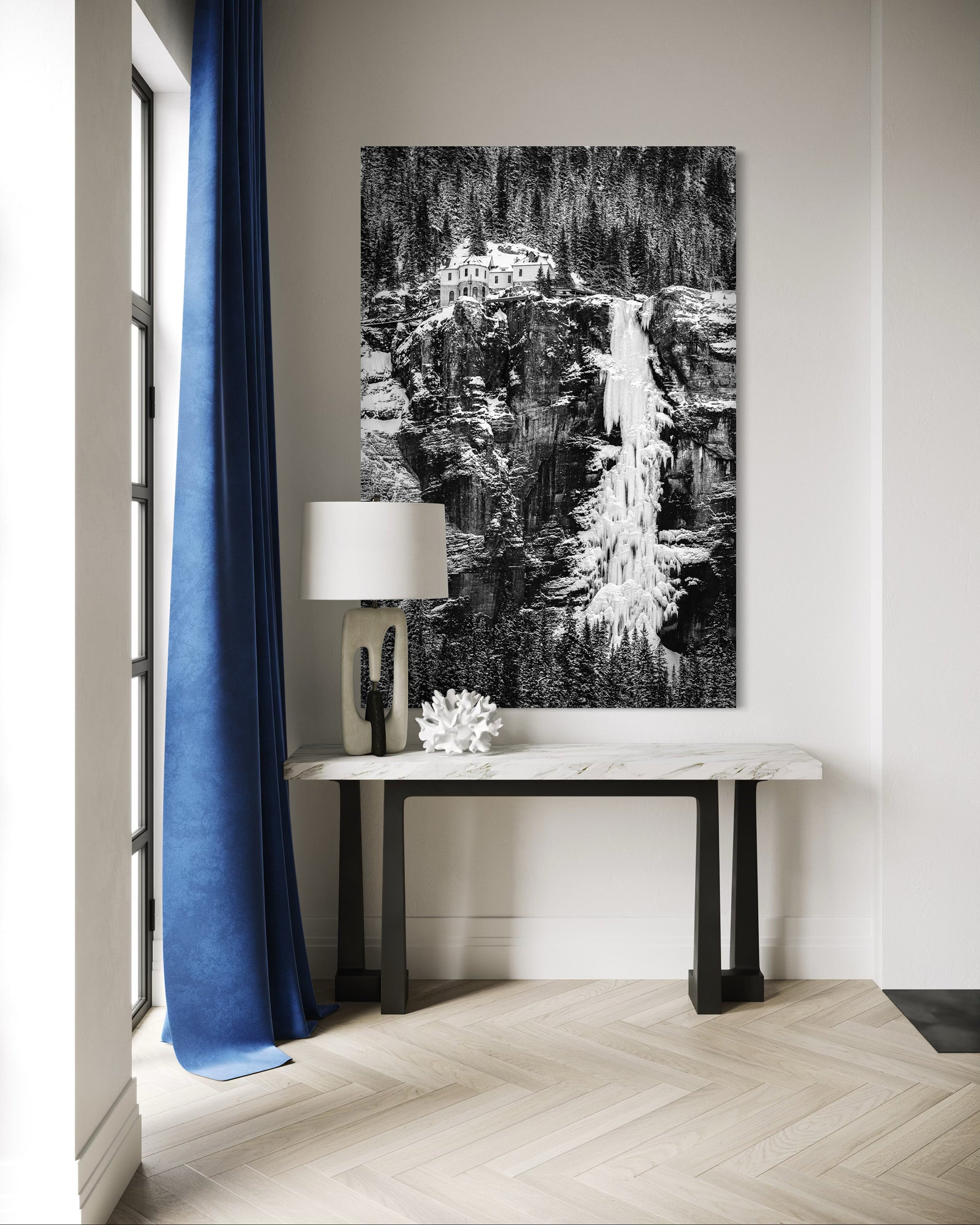 Modern interior design in telluride with fine art photography of waterfall, table, and lamp